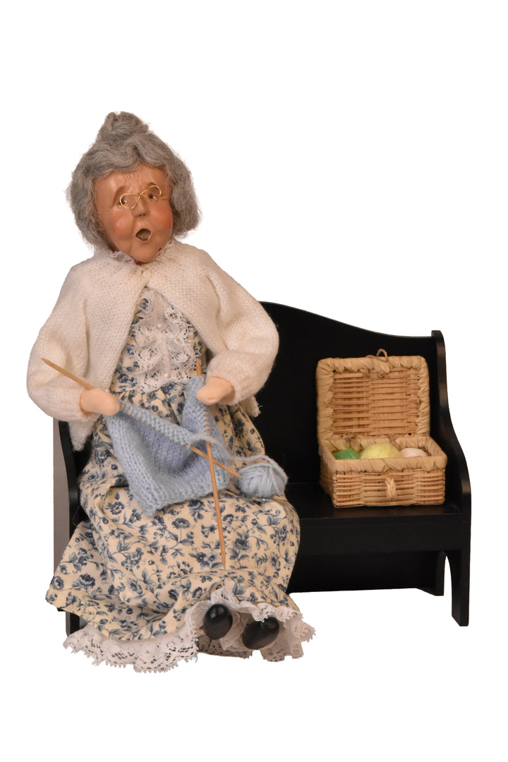 Grandmother Knitting On Bench (2000) - Auction